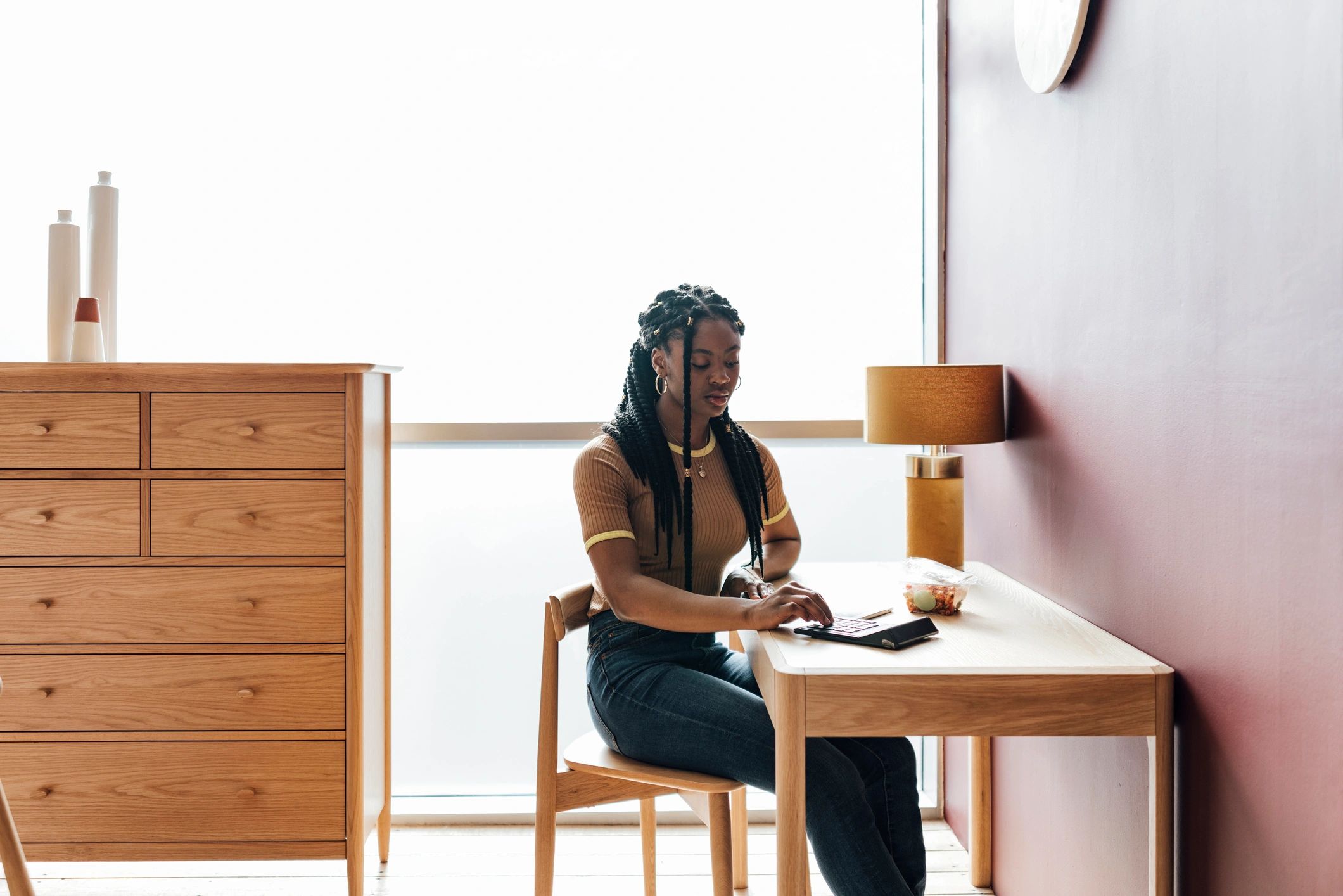 Author working thoughtfully at a desk
