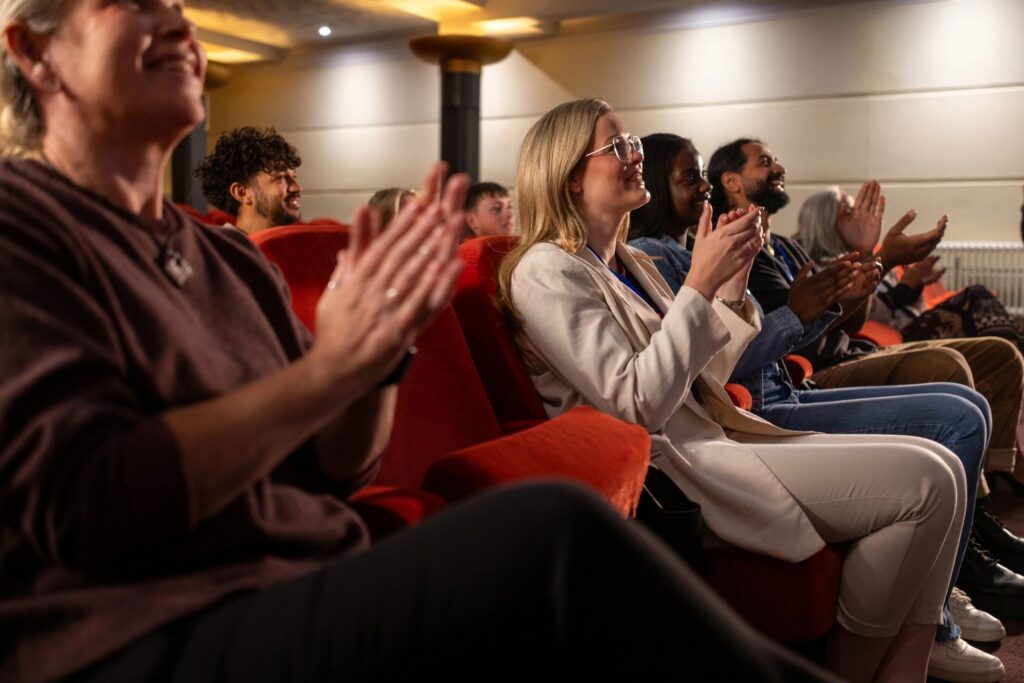 Diverse Attendees Listening to Live Business Seminar