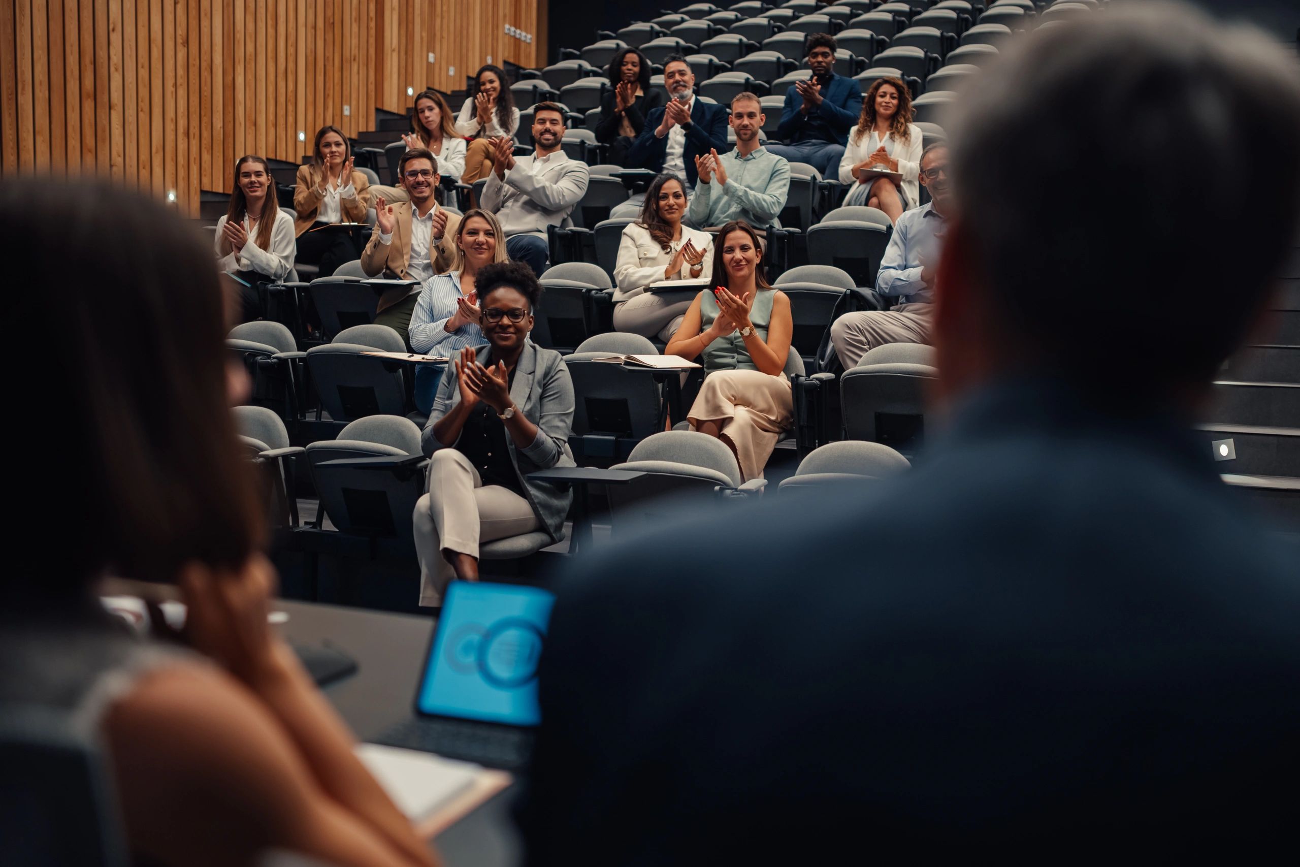 Business audience applauding a presentation